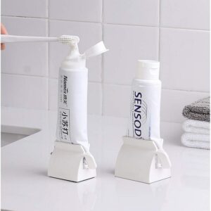 Rolling Tube Toothpaste Holder Stand Bathroom Organizer promax.pk